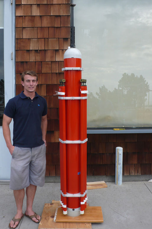 A SOLO-TREC underwater vehicle next to Kyle Grindley, an engineer at the Scripps Institution of Oceanography who helped design it. Credit: Scripps Institution of Oceanography, University of California, San Diego.