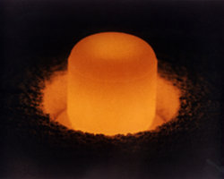 A plug of plutonium, which provides heat for TE generators in space. On the road, waste heat from car engines and exhaust pipes will do the job.