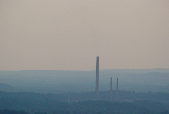 Smokestacks from a coal power plant in Maryland jut into a hazy skyline. Credit: Jeff Stehr, University of Maryland