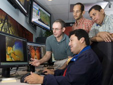 The SERVIR program brings satellite information to local decision makers to address threats related to climate change, biodiversity, and extreme events. University of Alabama-Huntsville scientist Danny Hardin (left) trains researchers from El Salvador to use SERVIR. Credit: SERVIR.