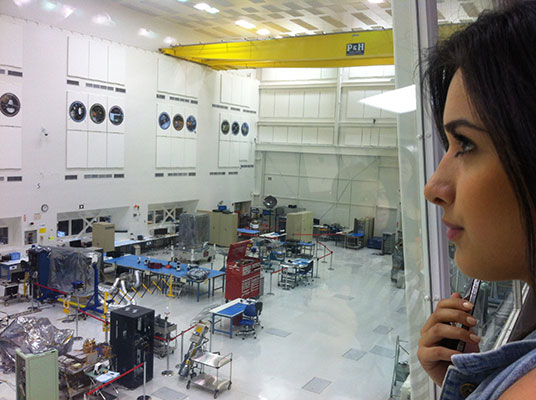 Glendale Community College student Alina Bedrosian in the high bay overlooking JPL’s Spacecraft Assembly Facility used for assembly and test of space hardware similar to OCO-2.