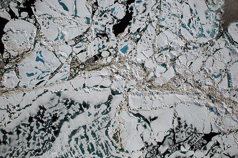 Chunks of sea ice, melt ponds and open water are all seen in this image captured at an altitude of 1,500 feet by the NASA&#39;s Digital Mapping System instrument during an Operation IceBridge flight over the Chukchi Sea on Saturday, July 16, 2016. Credit: NASA/Goddard/Operation IceBridge.