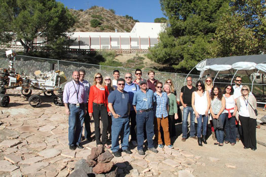 The Hollywood, Health and Society group poses with a model of the Mars Rover Curiosity.