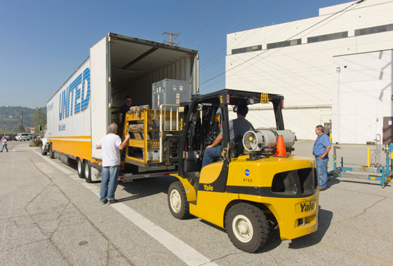 Technicians load the OCO-2 instrument and its ground support equipment aboard a moving van at JPL in preparation for its trek to Orbital Science Corporation's Satellite Manufacturing Facility in Gilbert, Ariz. Credit: NASA/JPL-Caltech.