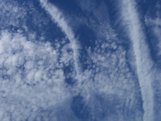 Contrails and hole punch clouds near Norfolk, Virginia on June 20, 2004. Credit: Lin Chambers/NASA