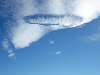A hole punch cloud visible over Omarama, New Zealand in May 2006. Credit: Dollsworth