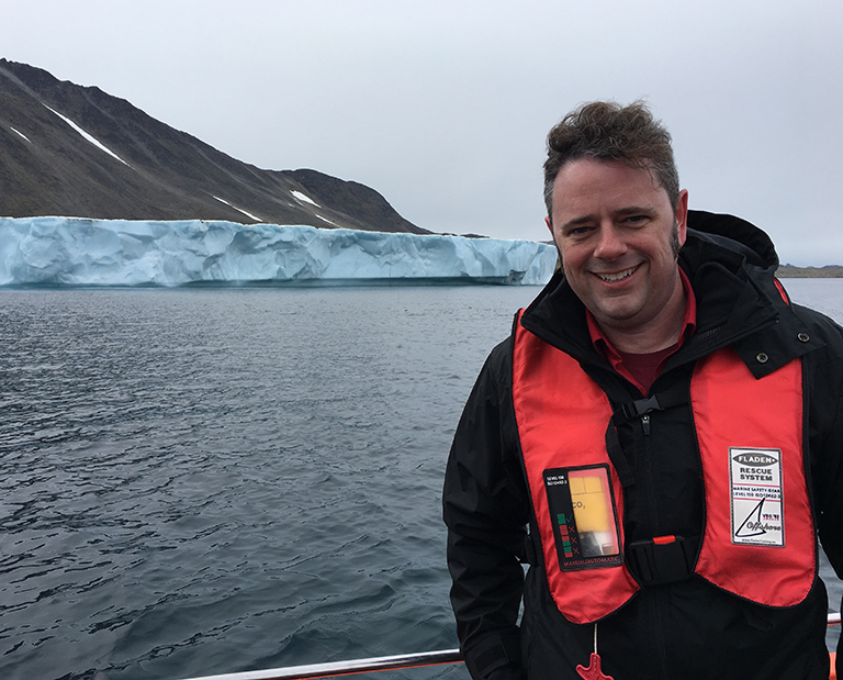Josh Willis, OMG’s principal investigator, on approach by boat to Apusiaajik glacier in Greenland.