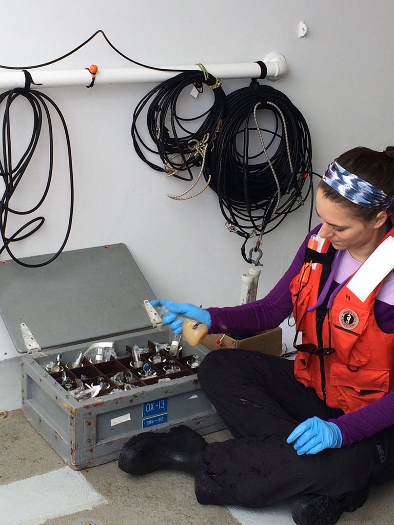 Alex Niebergall helps with Winkler titrations by mixing reagents with water samples to fix the dissolved oxygen.