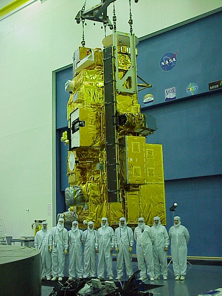 Terra's test team stands in front of the satellite during its construction and testing phase.