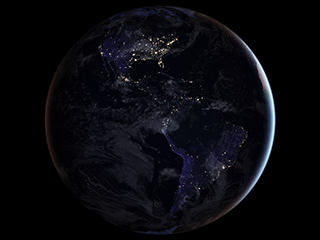 Earth at night as seen from space, with most lights showing in North America.