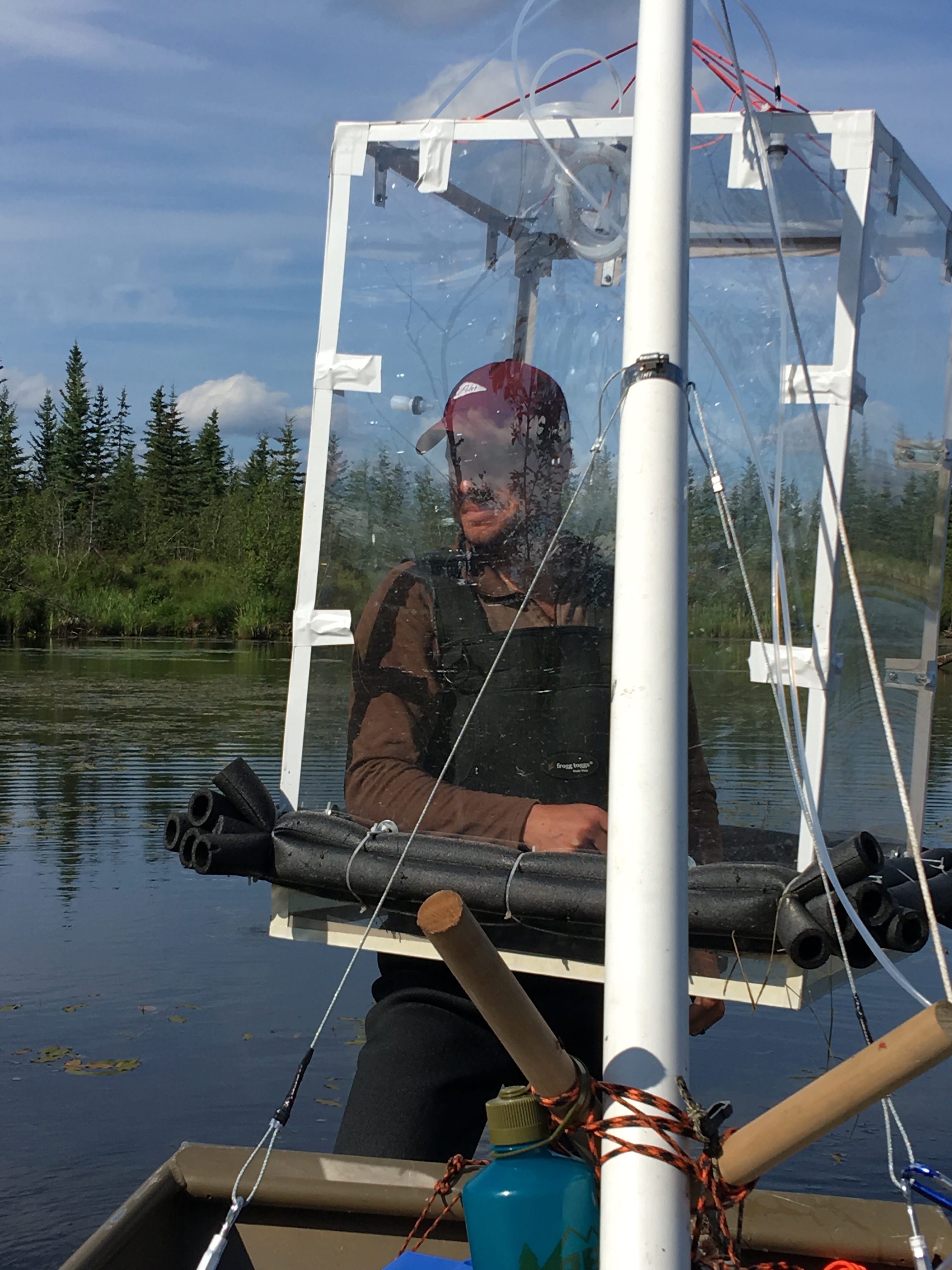 NASA JPL postdoctoral fellow Clayton Elder measures methane bubbling up from Big Trail Lake outside of Fairbanks, Alaska.