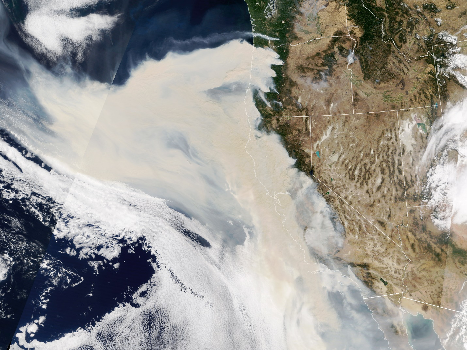 Thick smoke streaming from a line of intense wildfires in California and Oregon blankets much of the U.S. West Coast in this natural-color image captured September 9, 2020.
