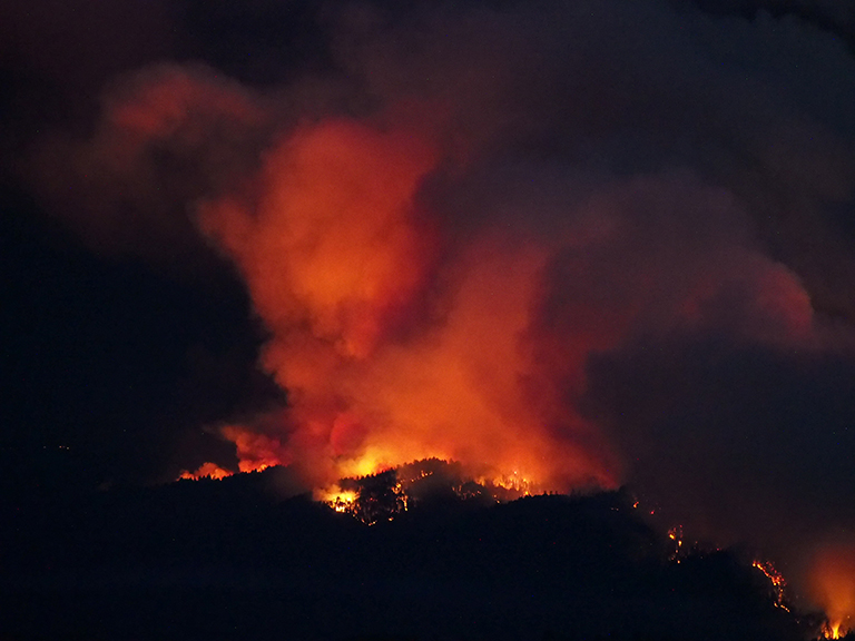 The CZU lightning complex fire burns along Butano Ridge and in Pescadero Creek Park in California's Santa Cruz Mountains.
