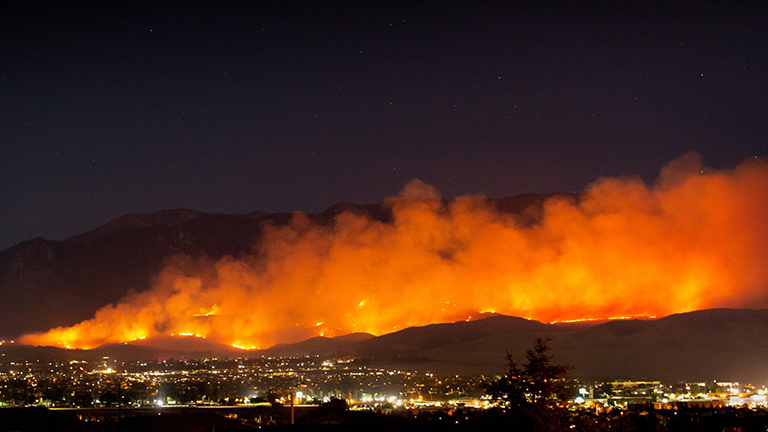 The Apple Fire burns into the night north of Beaumont, California, on Friday, July 31, 2020.