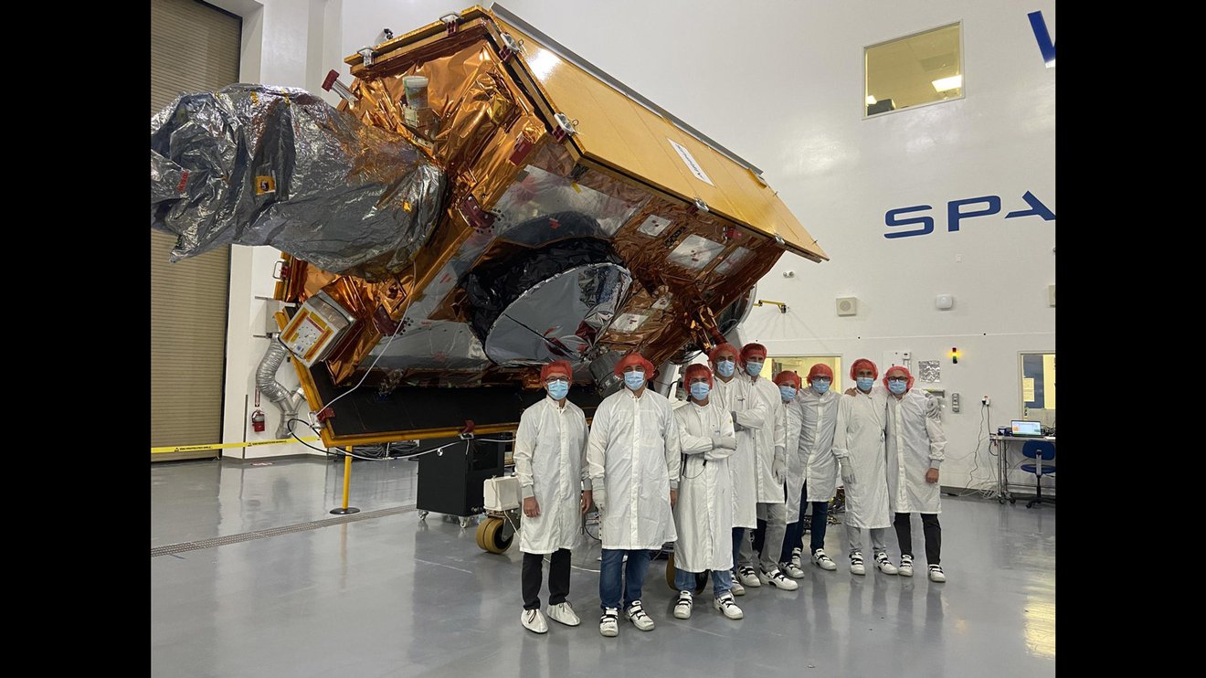 Satellite in a clean room undergoing final preparations before launch