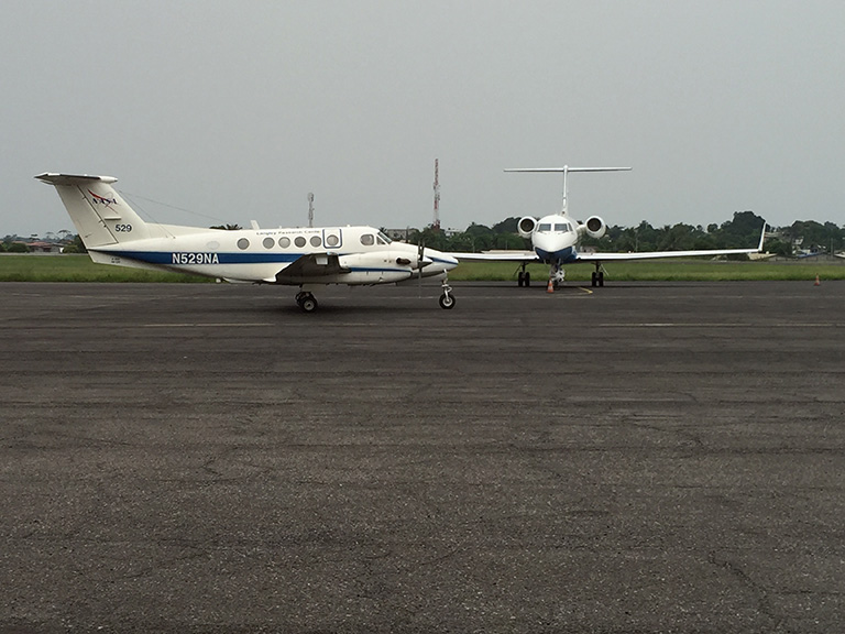 The two NASA AFriSAR research aircraft: the B-200 airplane (left) carries a laser altimeter, while the C-20A aircraft (right) transports JPL's UAVSAR radar. Both instruments collect measurements of surface topography and vegetation structure, creating 3D maps of their targets. Credit: NASA.