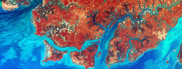 GUINEA-BISSAU COAST: Guinea-Bissau is a small country in West Africa. Complex patterns can be seen in the shallow waters along its coastline, where silt carried by the Geba and other rivers washes out into the Atlantic Ocean. Image taken by Landsat 7 on December 1, 2000.
