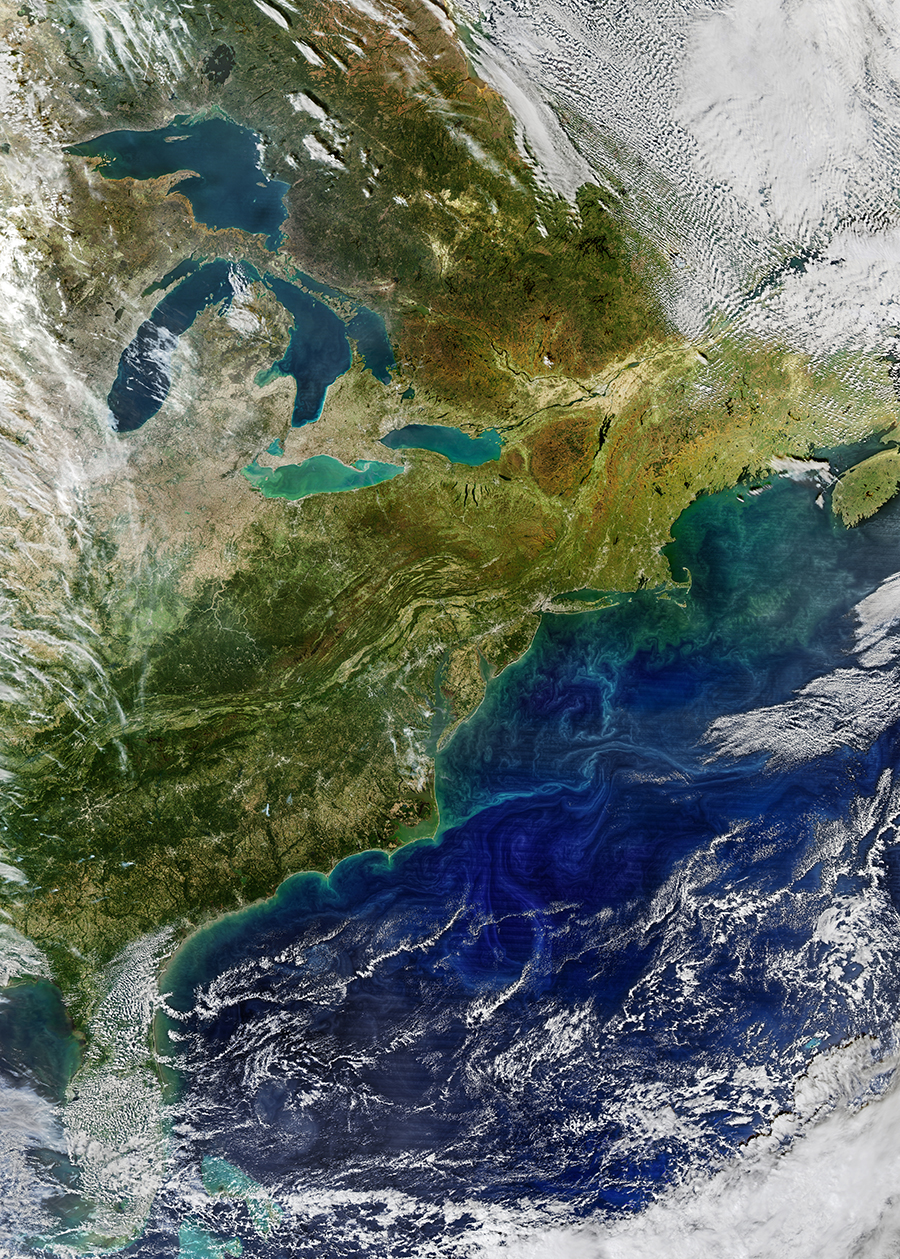 Changing colors across land and ocean are revealed as autumn comes to North America. As chlorophyll begins to cede its dominance to other pigments in the photosynthetic process, yellow and orange tones are revealed. Meanwhile, in the ocean and lakes, phytoplankton pigments highlight different water masses and current systems.