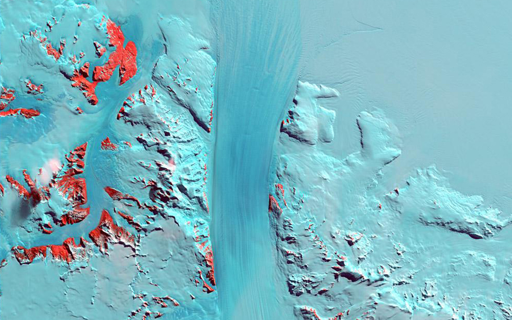 Byrd Glacier is a 15-mile- (24-kilometer-) wide, 100-mile- (161-kilometer-) long ice stream that plunges through a deep valley in the Transatlantic Mountains and into the Ross Ice Shelf. It moves towards the sea at a rate of about half a mile (0.8 kilometers) per year. This snapshot of the glacier was taken on January 11, 2000.