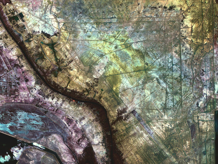 WALLED OFF: In an area north of the city of Al-Basrah, Iraq, which borders Iran, a former wetland has been drained and walled off. Now littered with minefields and gun emplacements, it is a staging area for military exercises. This false-color composite image was made using near-infrared, red and green wavelengths of light. Taken by Landsat 7 on January 24, 2001.