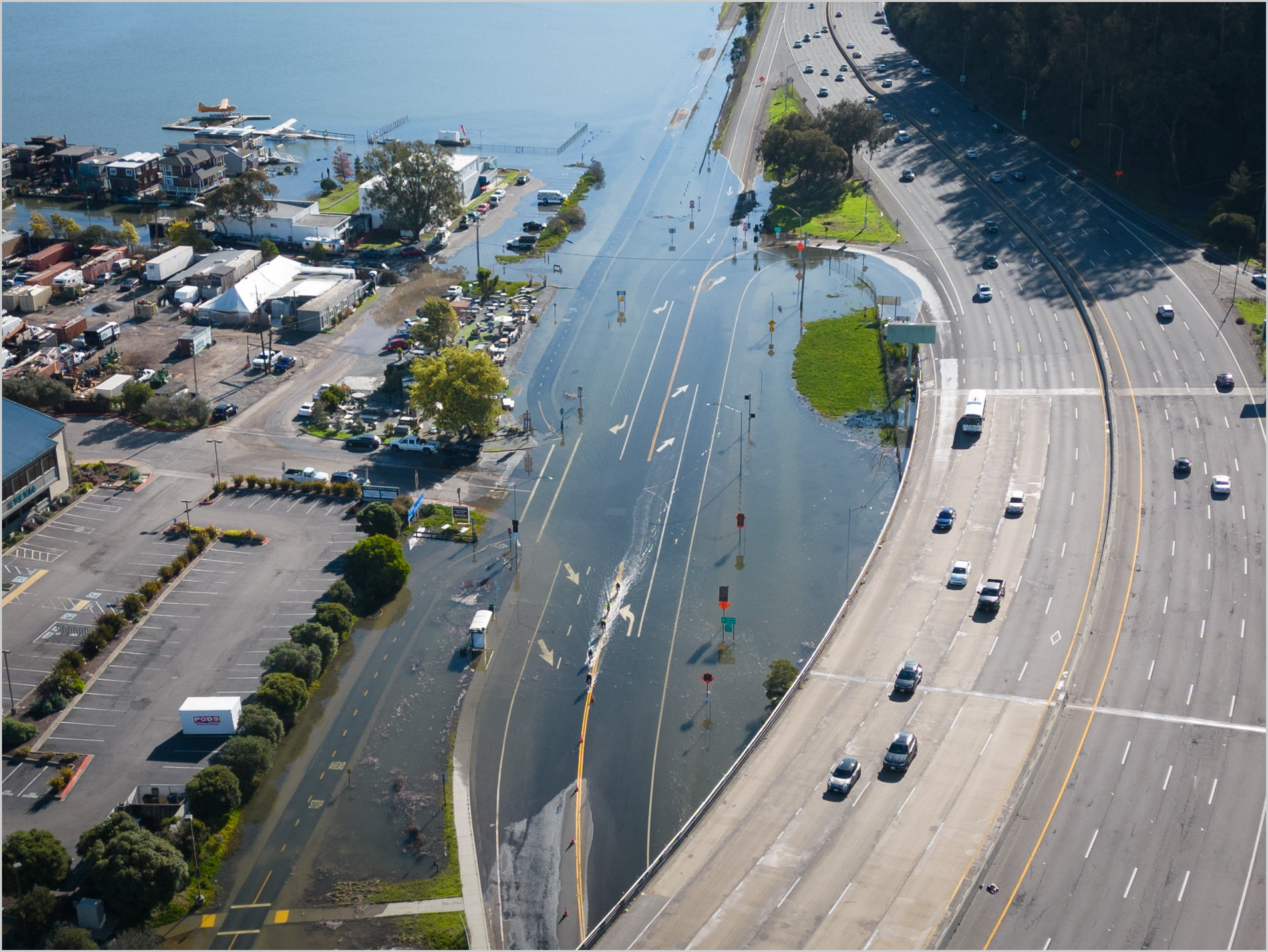 An unusually high tide, called a King Tide, floods a highway on-ramp in Northern California in January 2023. Sea level rise and El Niños can exacerbate this type of flooding. Credit: California King Tides Project
