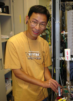 Zongping Shao, who is now a professor at Nanjing College of Chemistry in China, listens to an MP3 player being powered by two fuel cells.