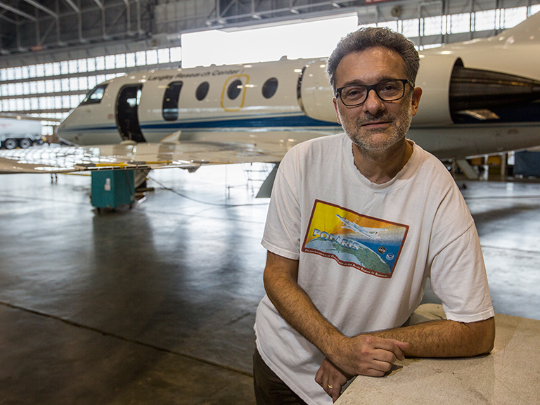 Jay Al-Saadi, LISTOS platform scientist from NASA Langley, with the HU-25 aircraft the NASA team is using for science flights.