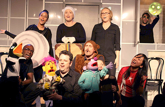 The Lollygaggers cast sings about shrinking your carbon footprint in a comedy show about global warming. NASA scientist Josh Willis and his co-creator, Rani O'Brien, are first row, center.