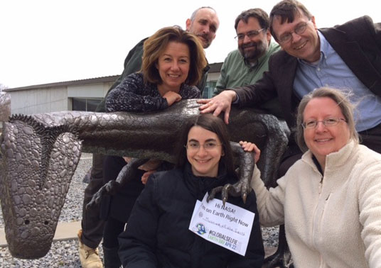 This talon-ted #GlobalSelfie comes to you courtesy of the Paleontological Research Institution and its Museum of the Earth in Ithaca, N.Y. Clockwise from top left: Mark Lucas, Don Duggan-Haas, Robert Ross, Ingrid Zabel, Andrielle Swaby and Laura Faye Tenenbaum pose with a dino friend.