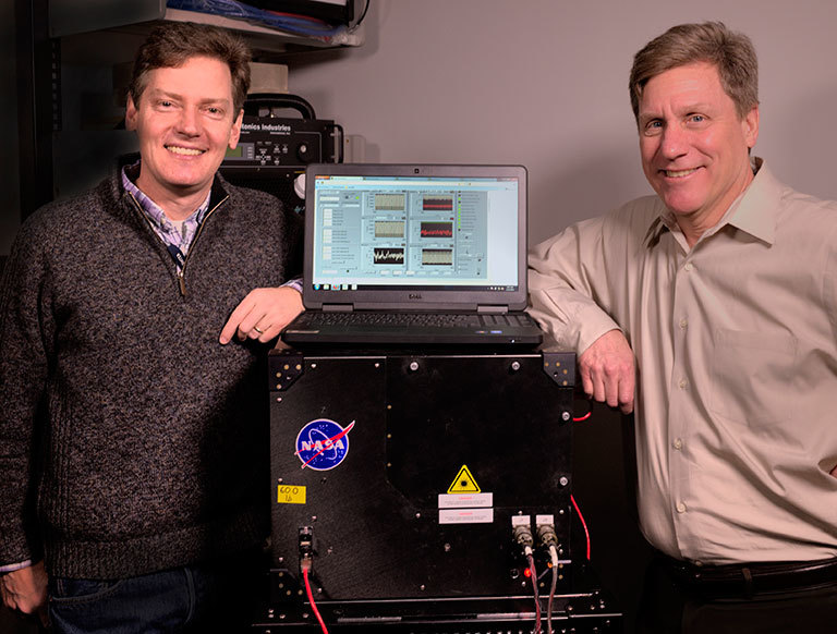 Goddard scientists Tom Hanisco (left) and Paul Newman (right) serve as science team co-investigators on NASA’s newest Earth Venture mission, the Atmospheric Tomography Mission (ATom). One of ATom’s instruments is a device (pictured here) that Hanisco developed to measure formaldehyde more efficiently. Credit: Bill Hrybyk/NASA. View larger image.