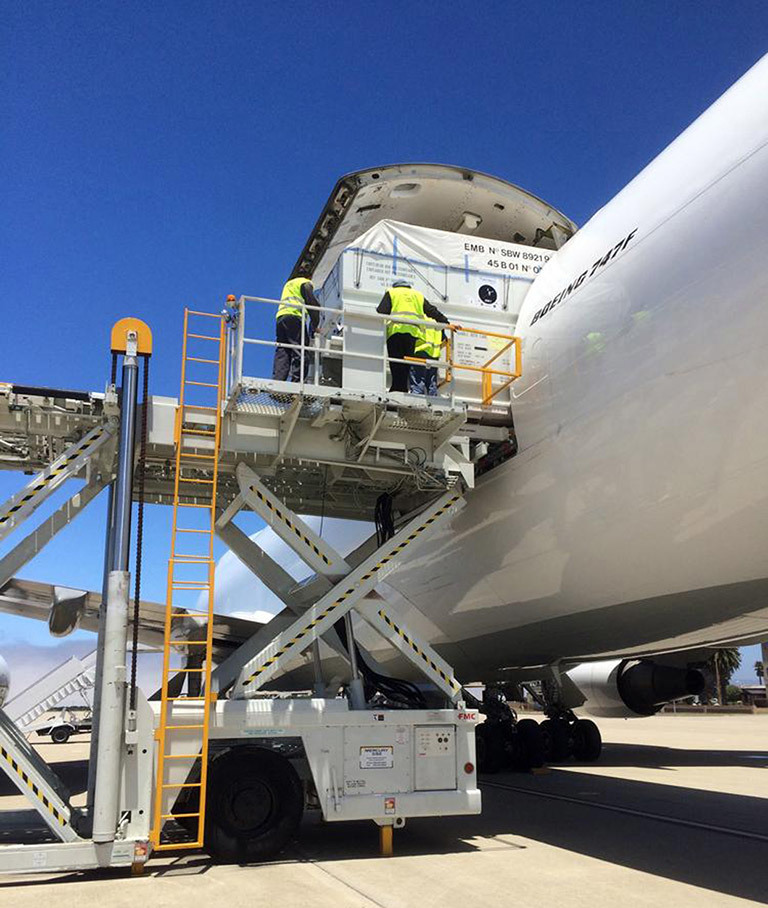 The Jason-3 spacecraft is unloaded from a 747 transport aircraft at Vandenberg Air Force Base, California, on June 18, 2015, concluding a journey from the Thales Alenia Space manufacturing facility in France. The Jason-3 satellite altimetry mission is scheduled to launch this August. Credits: NASA