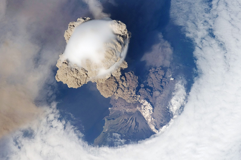 This is a plume of ash from the Sarychev volcano in the Kuril islands, northeast of Japan. The picture was taken from the International Space Station during the early stage of the volcano's eruption on June 12, 2009. Credit: NASA. Full caption. View larger image.