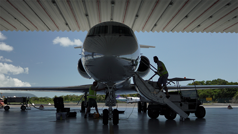 A photo nose-on of NASA's Gulfstream III jet in its hangar.