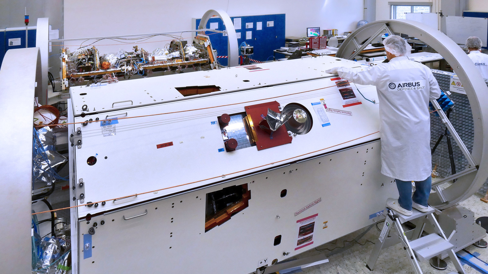 A technician inspects one of the two satellites for NASA's Gravity Recovery and Climate Experiment Follow-On (GRACE-FO) mission at the Airbus Defence and Space manufacturing facility in Friedrichshafen, Germany. The other GRACE-FO satellite is visible in the background. Credit: Airbus DS GmbH-A.Ruttloff 2016.