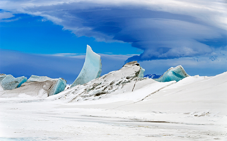 This beautiful aerial photograph shows a multi-layered lenticular cloud hovering near Mount Discovery in Antarctica, a volcano about 70 kilometers (44 miles) southwest of McMurdo. Credit: Michael Studinger, Operation IceBridge. Download larger image.