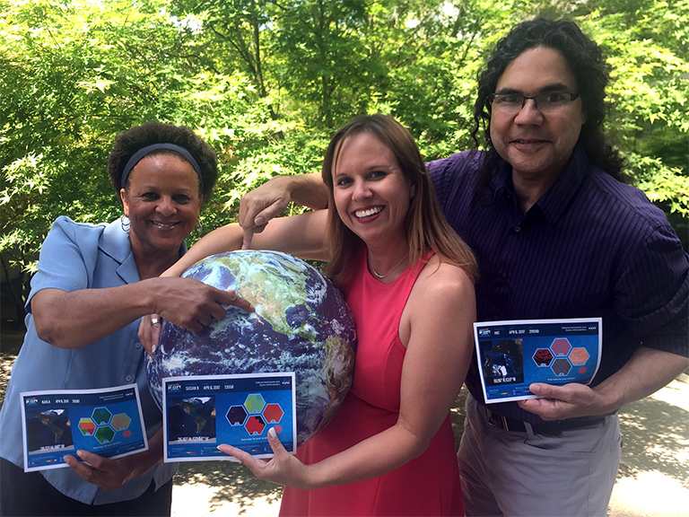 NASA JPL employees Karla Miller, Susan Bell and Pat Brennan share their adopted pieces, three of the 64,000 locations on Earth available. Which one will you get? Credit: NASA/JPL/Arielle Samuelson.