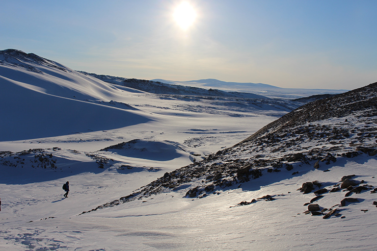 Hiking up to Greenland’s ice sheet, the sun remains low on the horizon even during midday.