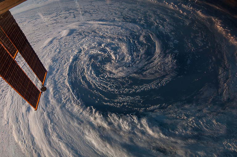 A pre-winter storm located just off the coast of southwestern Australia was photographed from the International Space Station on March 29, 2014. A solar array panel on the orbital outpost is in the left side of the frame.