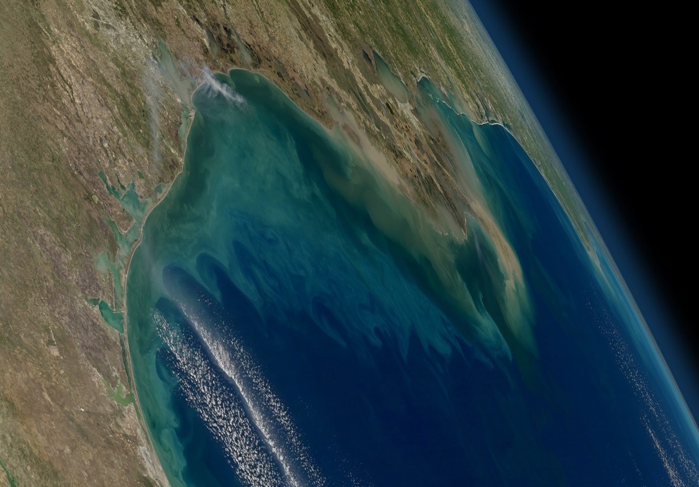 NASA's Geosynchronous Littoral Imaging and Monitoring Radiometer (GLIMR) instrument will collect high-resolution observations of coastal ecosystems in such areas as the northern Gulf of Mexico, shown in this image with phytoplankton blooms stretching from the Texas and Louisiana coast (left) across the Mississippi River delta (center) toward Florida (far right). Credit: NASA