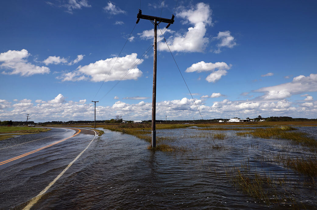 Rising seas will exacerbate problems that coastal communities are already dealing with, including high-tide, or “nuisance,” floods. Inundated roadways like this one in Virginia are among the consequences of such floods. Credit: Aileen Devlin, Virginia Sea Grant

License