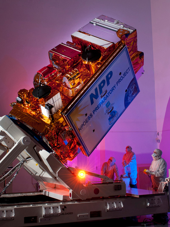 This photograph shows the NPP satellite at the Ball Aerospace facility. NPP will carry the Ozone Mapping and Profiling Suite, consisting of two ozone-measuring instruments. Credit: Ball Aerospace
