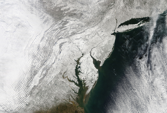A blocking event over Greenland led to intense blizzards in the East Coast of the United States in February 2010. The Moderate Resolution Imaging Spectroradiometer (MODIS) on NASA’s Terra satellite captured this true-color image on February 11, 2010, after a second snow storm had hit the East Coast in less than a week. Credit: NASA MODIS Rapid Response Team/Jeff Schmaltz.