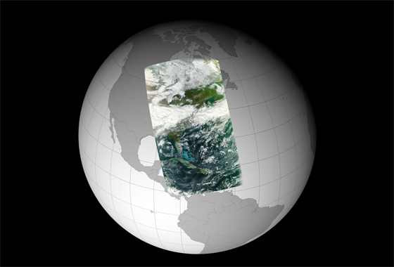 An image taken by the NPP Visible Infrared Imager Radiometer Suite (VIIRS) on Nov. 21, 2011. This high-resolution image is wrapped on a globe and shows a broad swath of Eastern North America from Canada’s Hudson Bay past Florida to the northern coast of Venezuela. The NASA NPP Team at the Space Science and Engineering Center, UW-Madison created the image using 3 channels (red, green and blue) of VIIRS data. Credit: NASA/NPP Team.