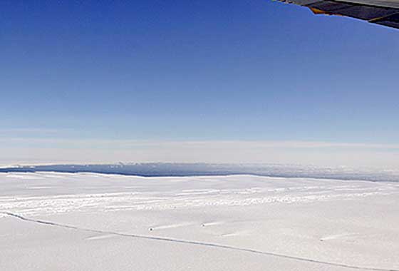 A large, miles-long crack was plainly visible across the ice shelf on the Pine Island Glacier during an overflight by NASA's DC-8 airborne science laboratory on Oct. 14, 2011, as part of Operation IceBridge, one of a number of NASA airborne Earth science missions flying in 2012. Credit: NASA/Michael Studinger.
