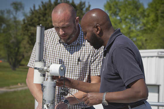 Travis Knepp, left, and Ali Omar, right, installed an AERONET instrument at the NASA Langley CAPABLE research site. Credit: Sean Smith/ NASA