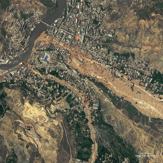 Around midnight on Aug. 8, 2010, a violent surge of loosened earth roared down mountain slopes and slammed into quietly sleeping neighborhoods in Zhouqu County in Gansu, China. The catastrophic mudslides -- the deadliest in decades according to state media -- buried some areas under as much as 23 feet (7 meters) of suffocating sludge. 1,765 people died. Property damages totaled an estimated $759 million. Cutting from right to left, this detailed image, from DigitalGlobe’s WorldView-2 satellite, shows the largest slide in the lower part of the city on Aug. 10, 2010.
Credit: Image from WorldView-2 © 2010 by DigitalGlobe